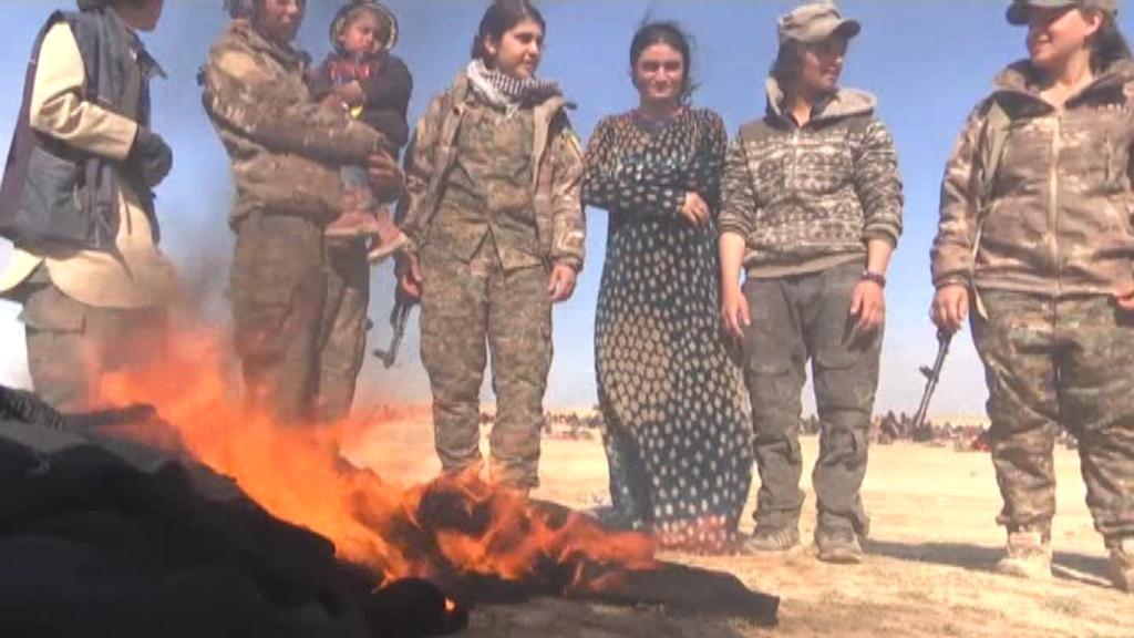 Yazidi sex slaves set fire to their burqas after being freed from ISIS