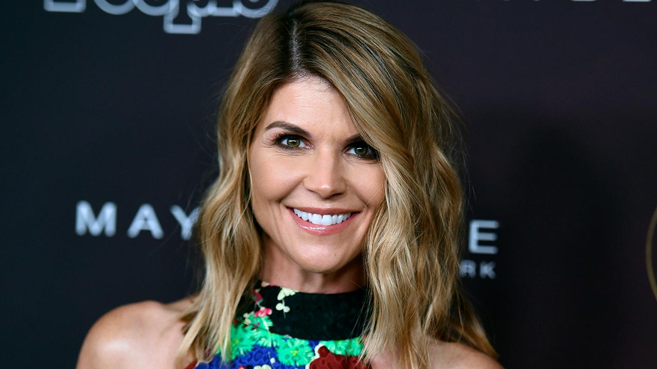 Actress Lori Loughlin taken into custody over college admissions scandal