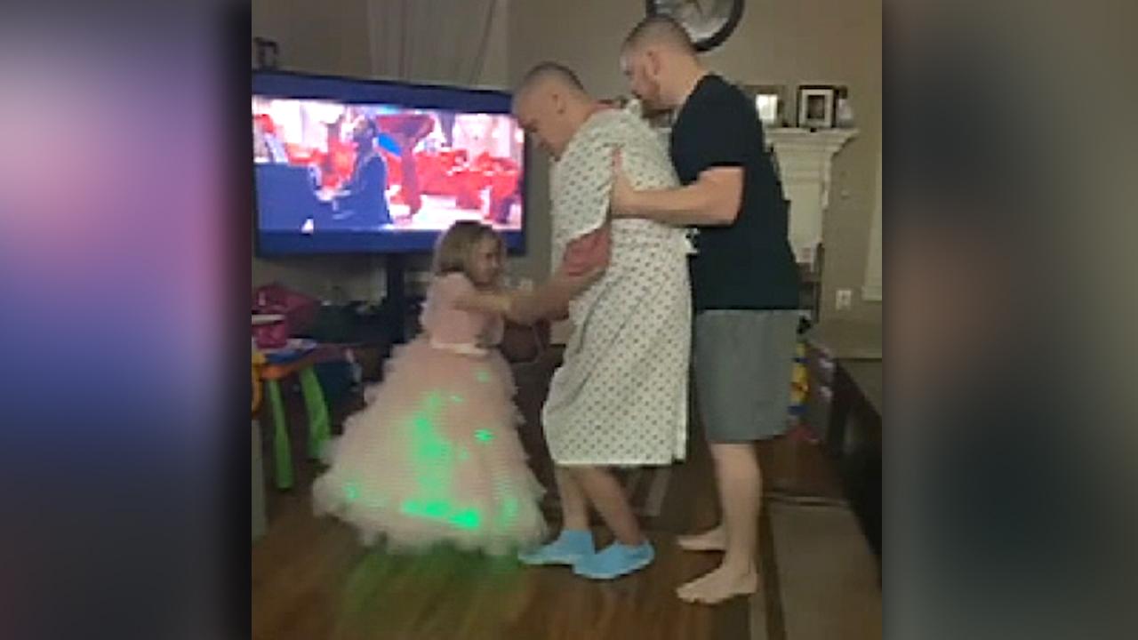 Alzheimer's patient dances with his 3-year-old granddaughter