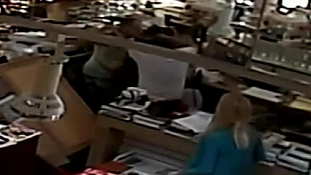 Security camera catches brawl between a jewelry store owner and a would-be thief