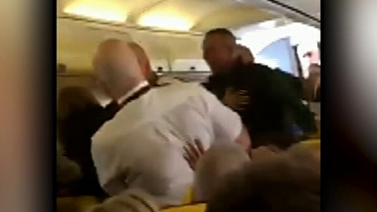 Raw video: Ryanair passengers filmed fighting mid flight