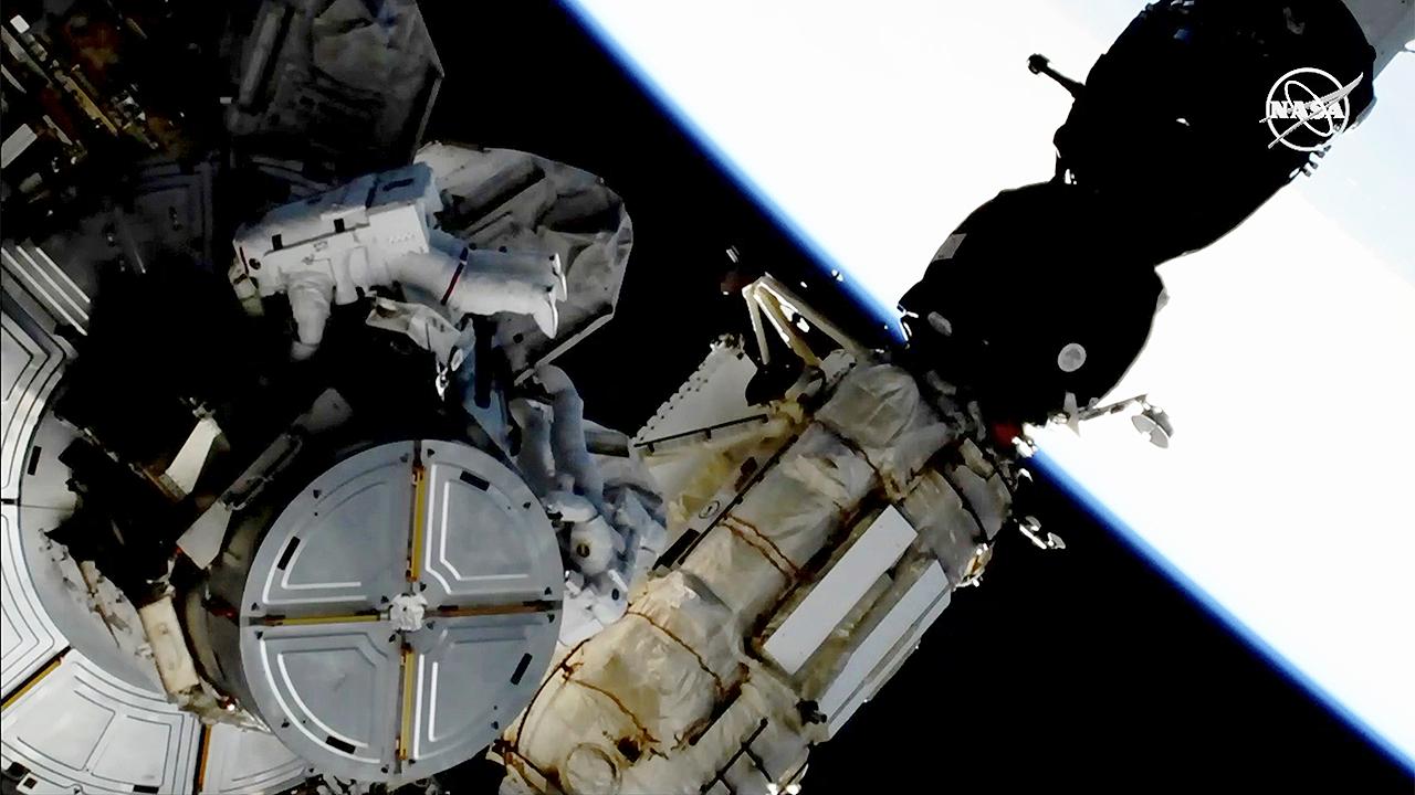 Astronauts perform spacewalk to upgrade International Space Station's power systems