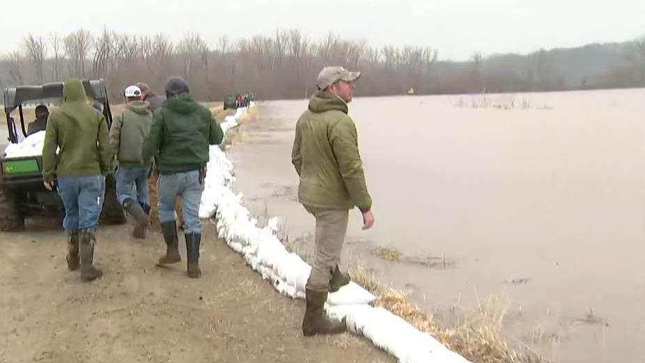 Army of flood fighters at work in Missouri as waters threaten farms