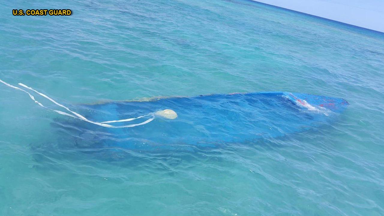Officials: Boat carrying migrants sinks in shark-infested waters, killing 15
