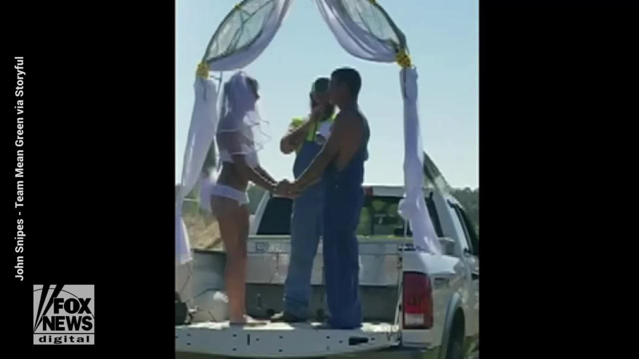 Video: Ahrielle and Jeremy Biddle say 'I do' on the bed of a pickup truck at Florida's Redneck Mud Park