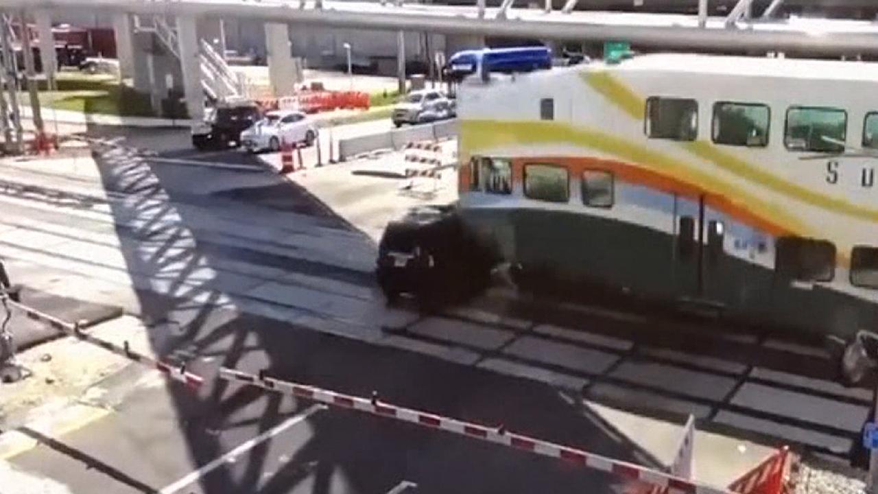 Commuter train crashes into SUV that drove onto tracks