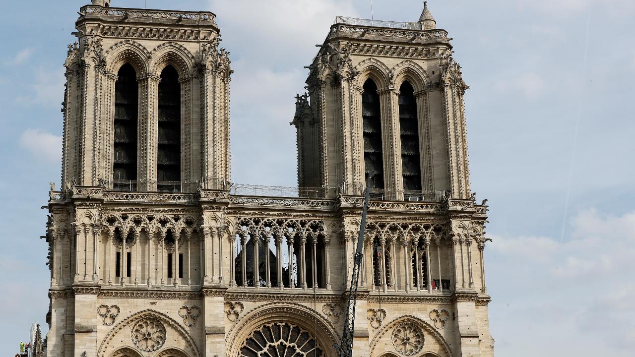 Spire, woodwork fall victim to Notre Dame fire but artifacts are saved