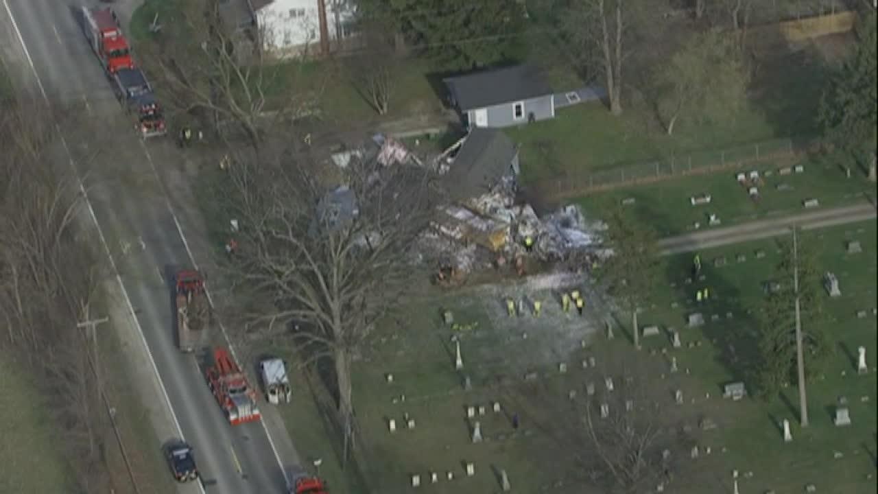 Raw video: Crews survey a site where a tractor trailer collided with a pickup truck then  smashed into a house