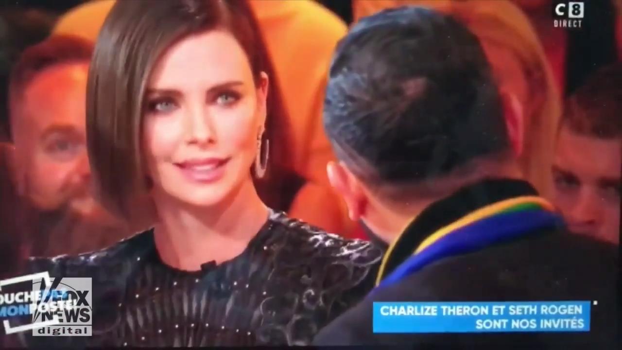 Charlize Theron scolds French TV host for kissing female interpreter: 'Ask next time'
