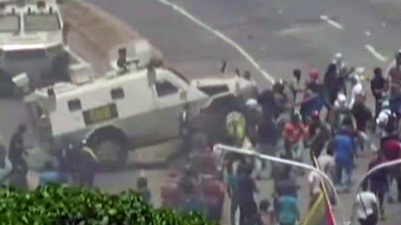 Warning, graphic video: Government vehicle runs over protesters in Venezuela