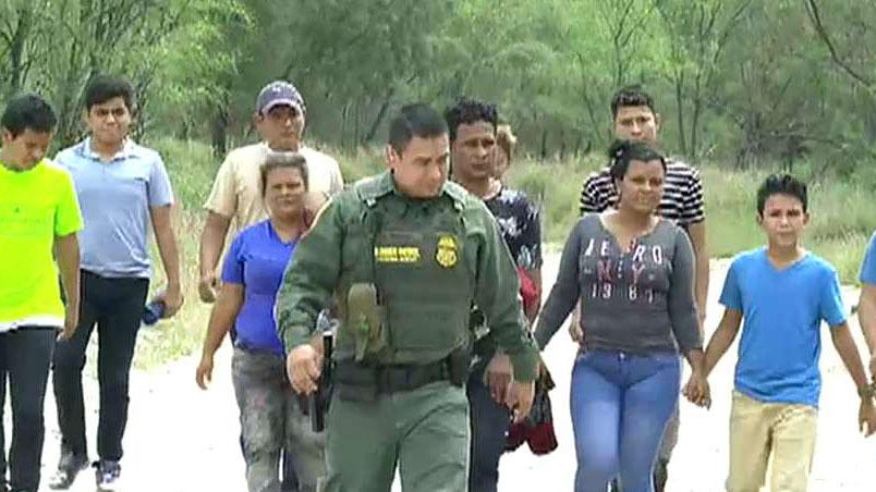 Smugglers ferry Central American migrants across the Rio Grande
