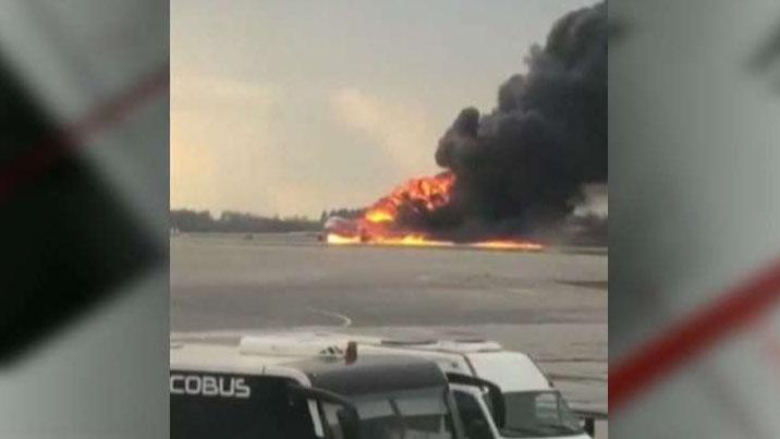 Plane lands in flames in Russia