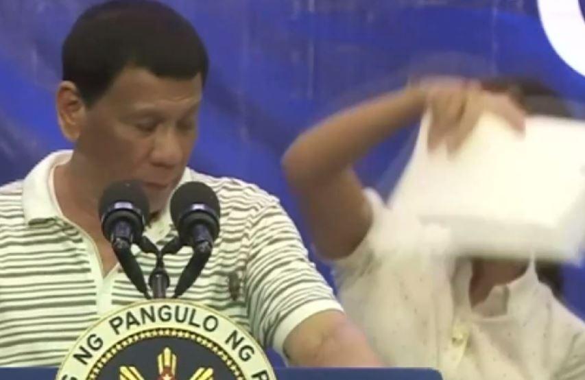 President Rodrigo Duterte of the Philippines gets interrupted by a cockroach during rally