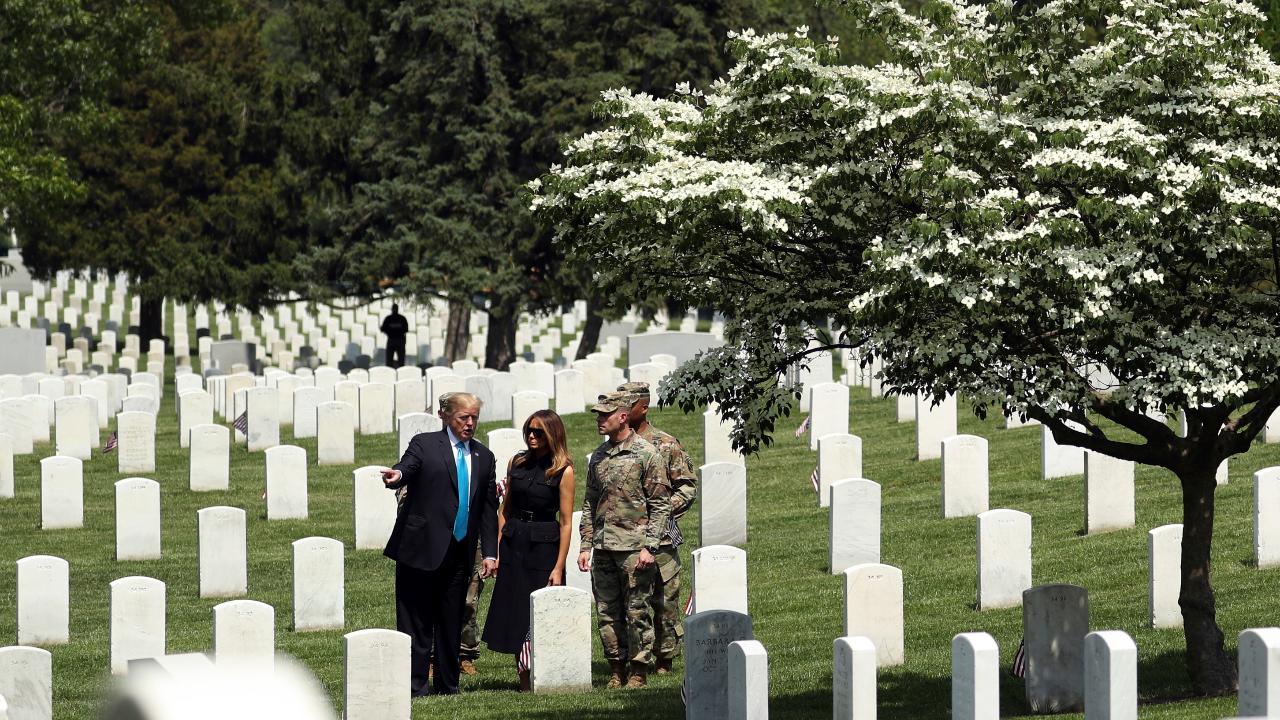 President Trump and first lady Melania Trump pay respects to fallen soldiers at Arlington National Cemetery
