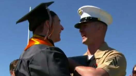 US Marine surprises brother at high school graduation by presenting his diploma