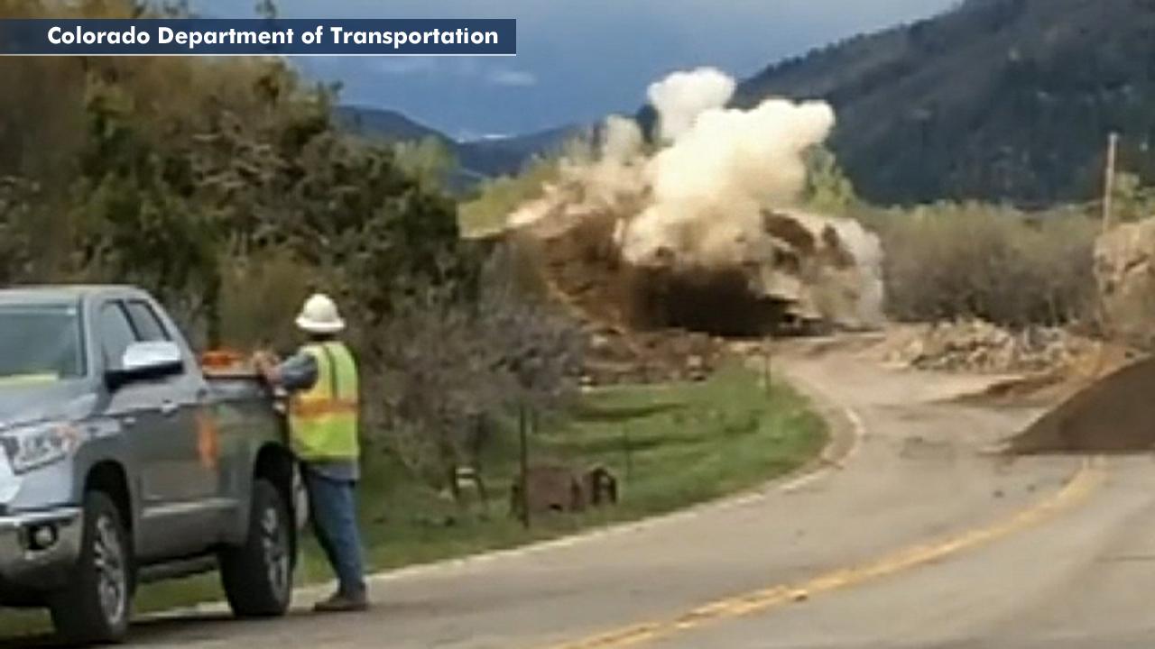 Fire in the hole! Construction crew blasts huge boulder that blocked highway in Colorado 