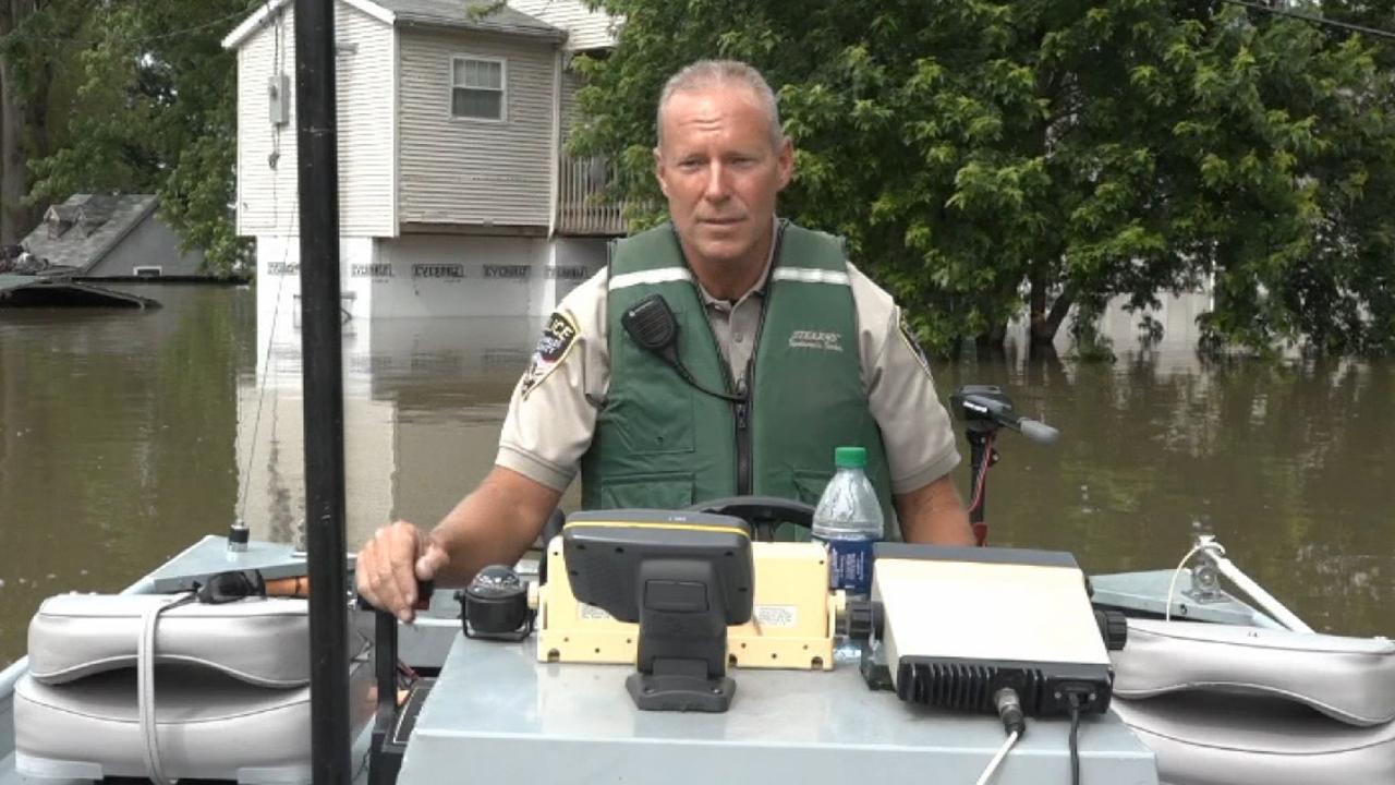 Police in Missouri patrol flooded streets in boats