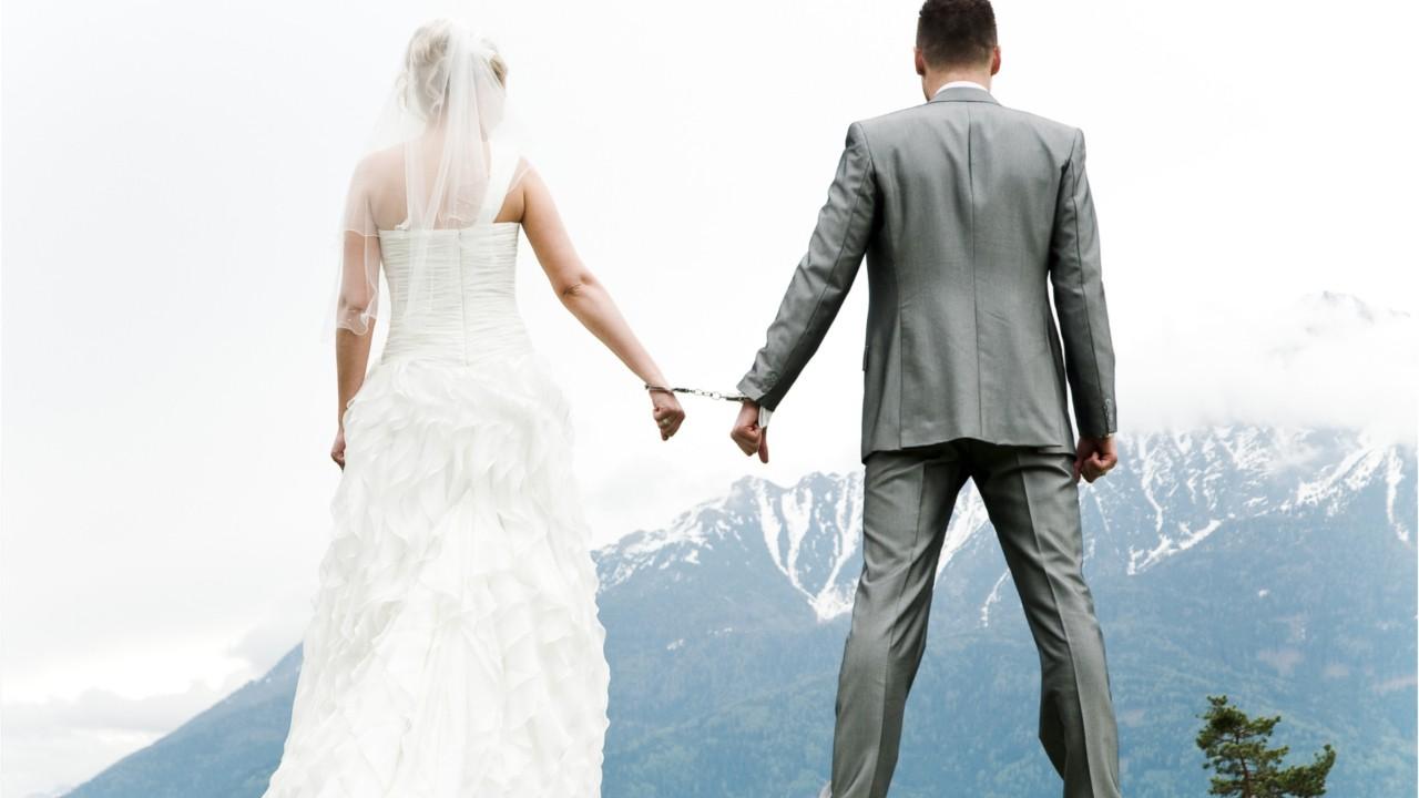 	Newlyweds and wedding guests get put in cuffs for breaking into building after ceremony