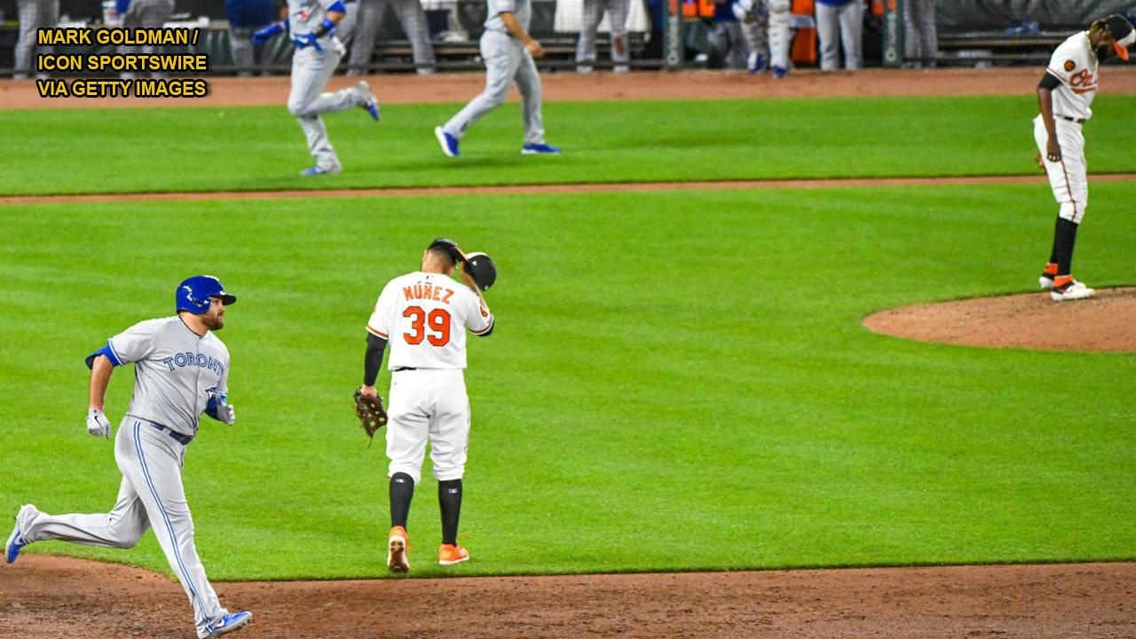 Baltimore Orioles fan grabs foul ball away from two youngsters