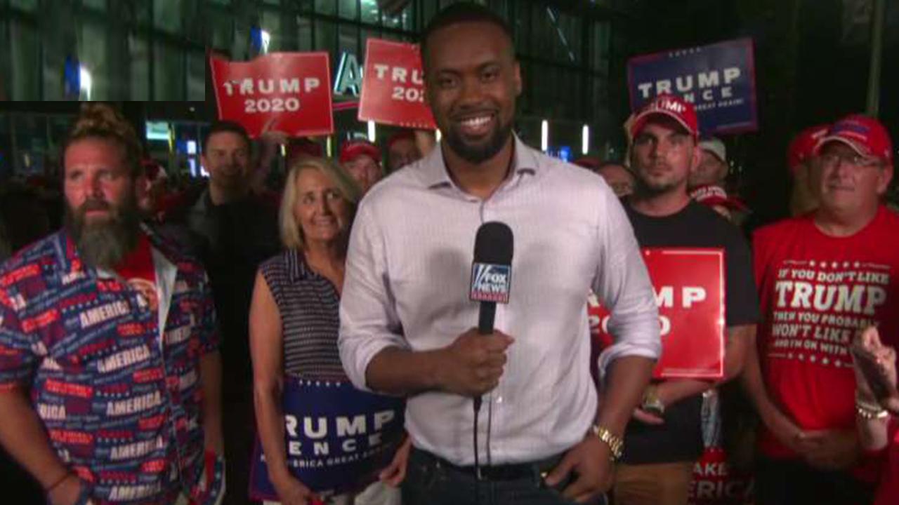 Lawrence Jones speaks with Trump supporters outside Orlando rally
