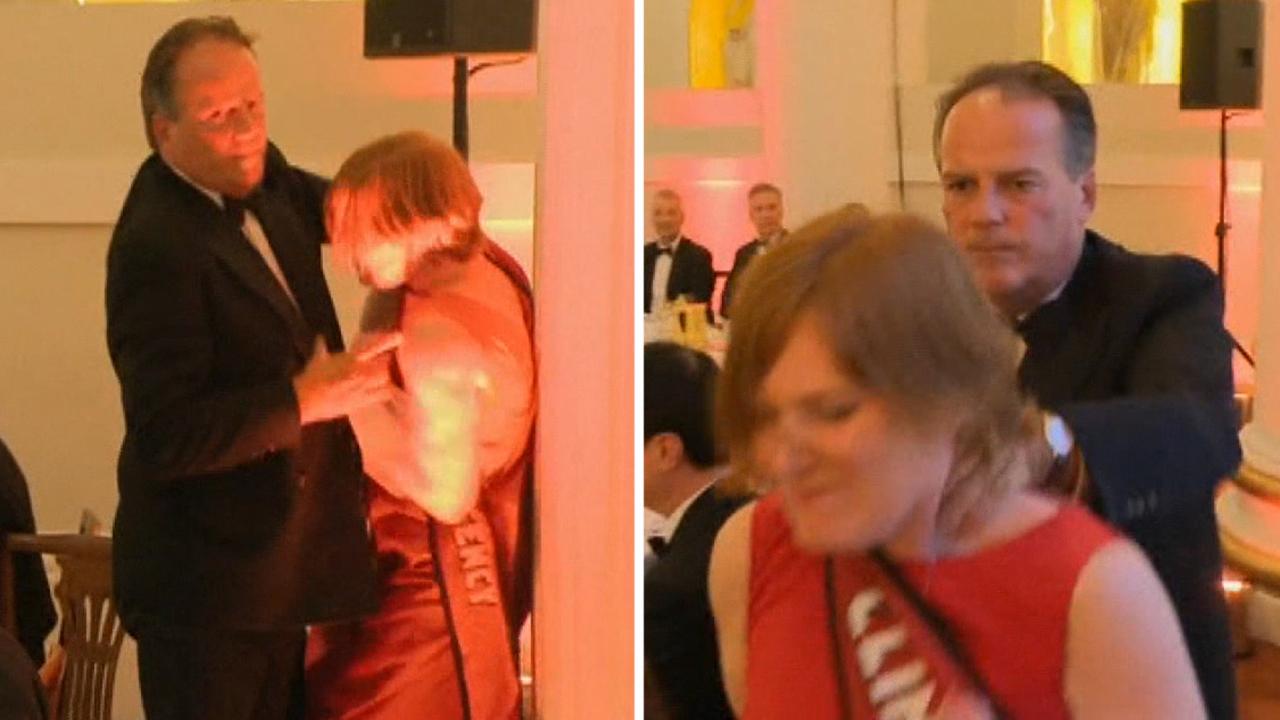 Conservative MP grabs climate change protester by the neck in London
