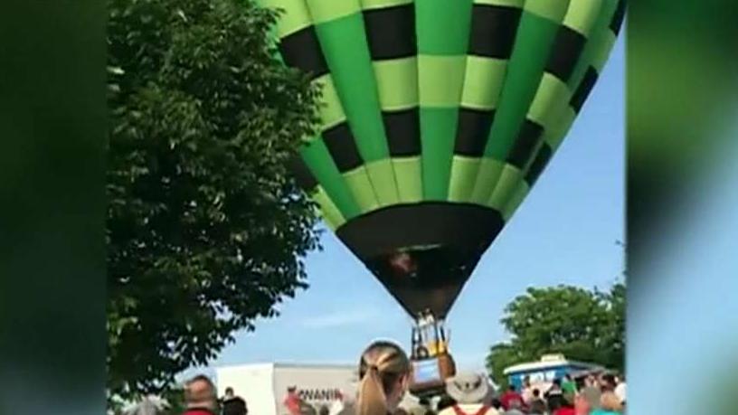 Hot air balloon flies through crowd at Missouri festival