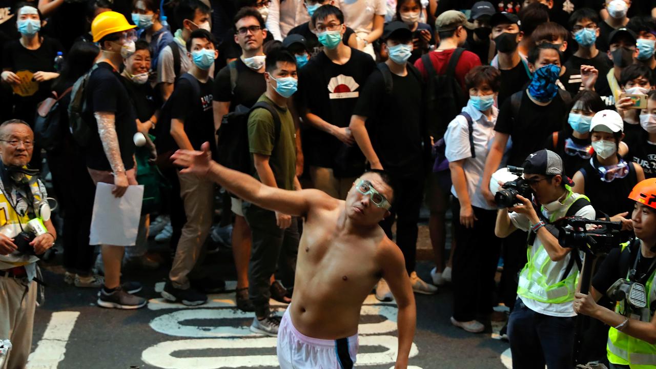 Demonstrators in Hong Kong shut down police headquarters