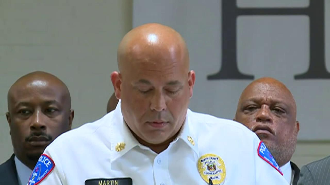 Police in Pine Lawn, Missouri brief the press on the fatal shooting of an officer