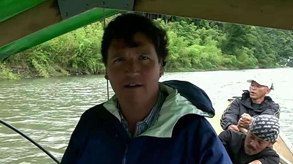 Tucker Carlson takes a boat on his way to Kyoto