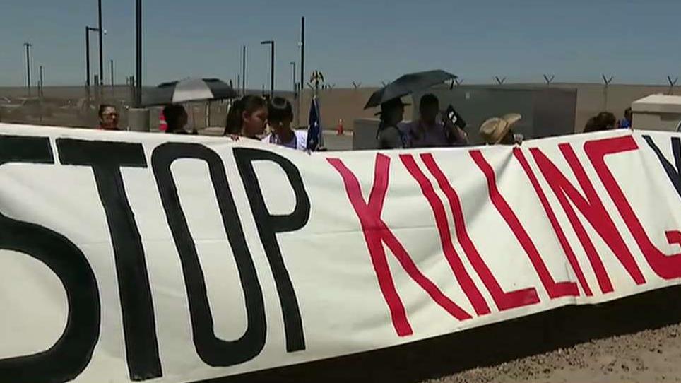 Demonstrators protest outside Texas border facility over reports of poor housing conditions