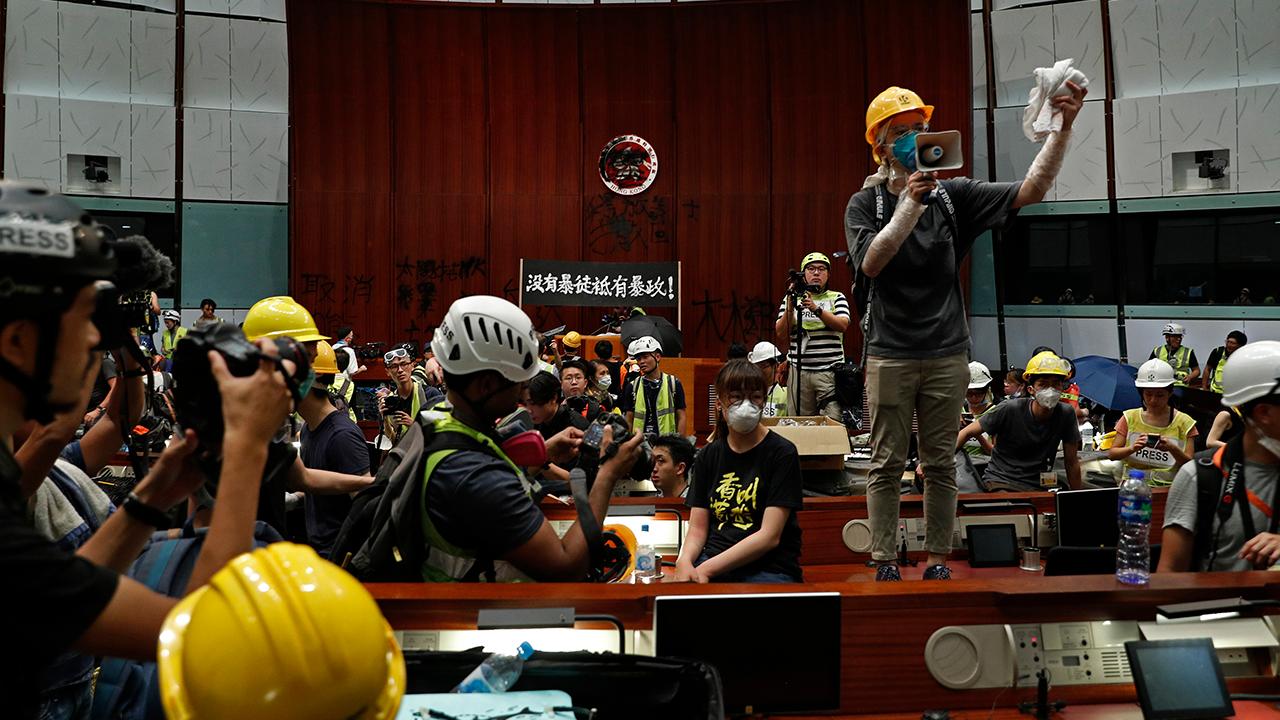 Pro-democracy activists storm government building in Hong Kong