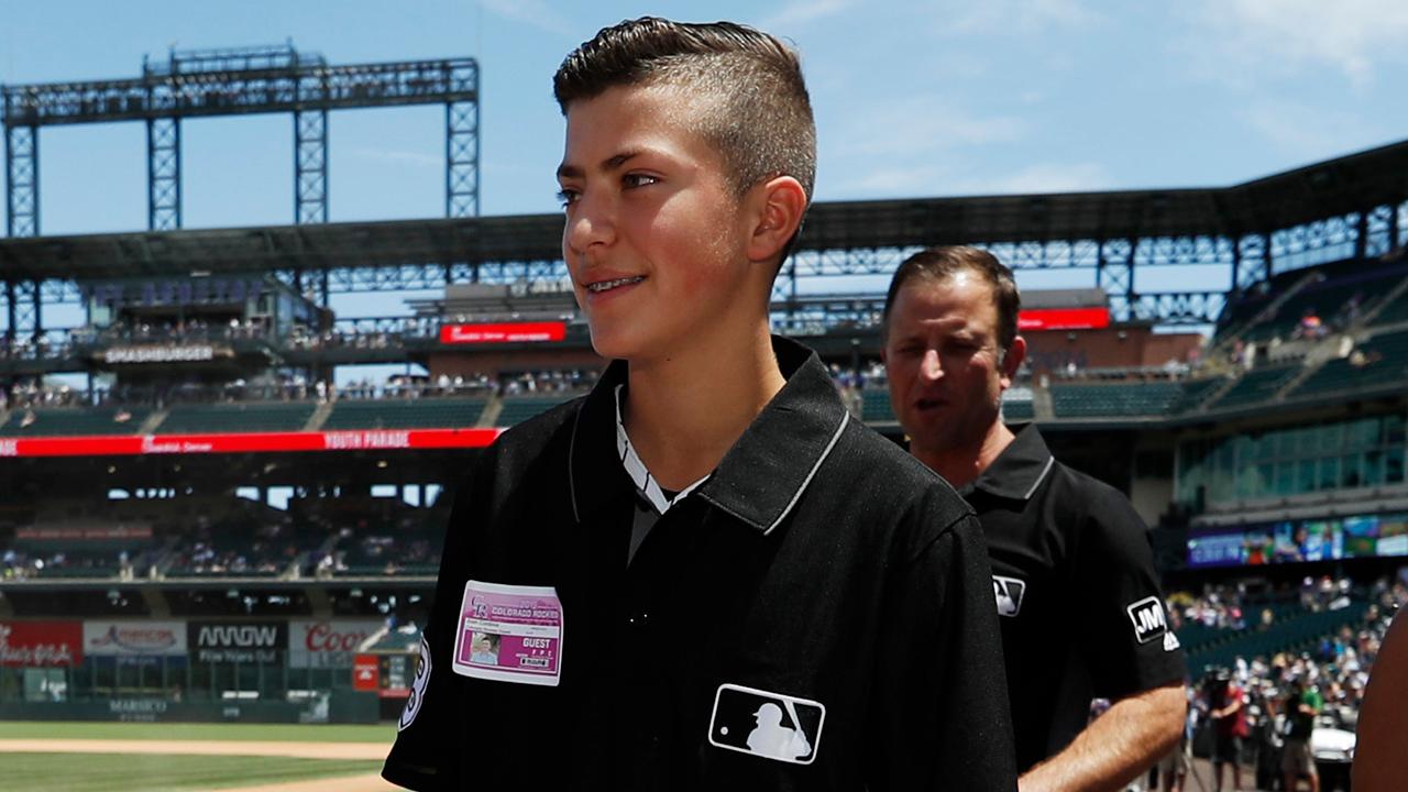 Teen umpire at center of baseball brawl honored at MLB game