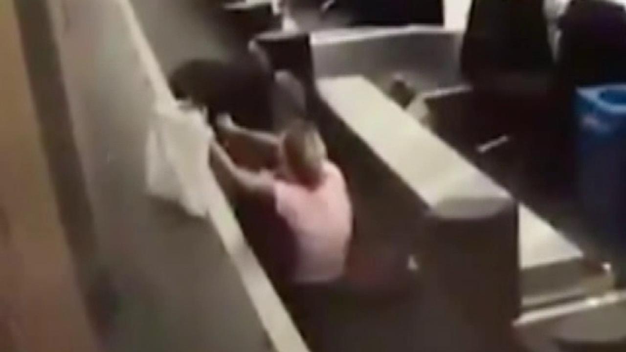 Raw video: Woman falls down after stepping on luggage belt
