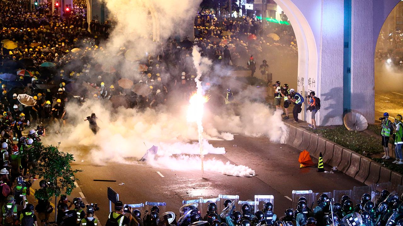 Hong Kong police grapple with more pro-democracy demonstrators