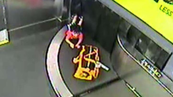 Toddler falls through airport baggage drop after climbing onto conveyor belt