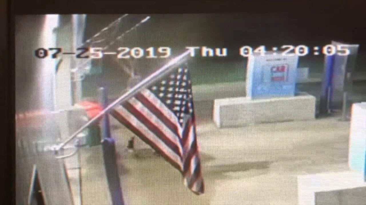 Teen caught stealing the American flag from business taught a lesson by passing out flags