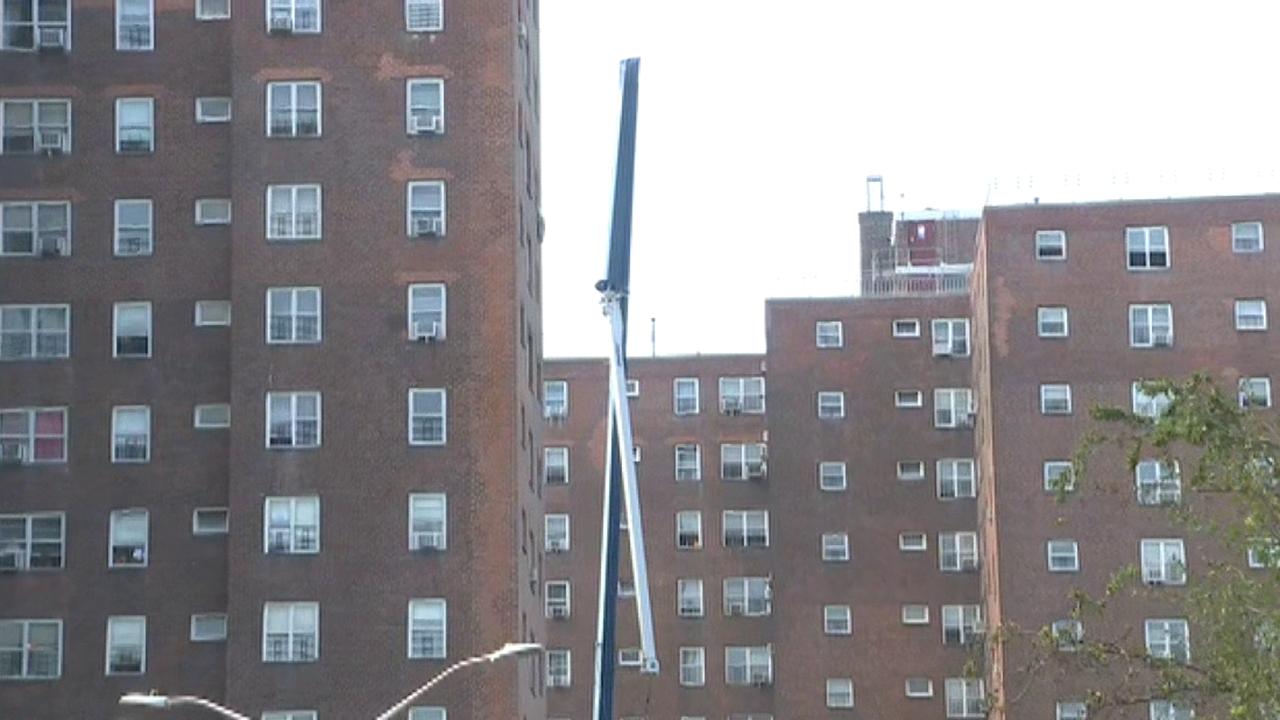 Raw video: Crane is folded in half after falling off of New York City high rise