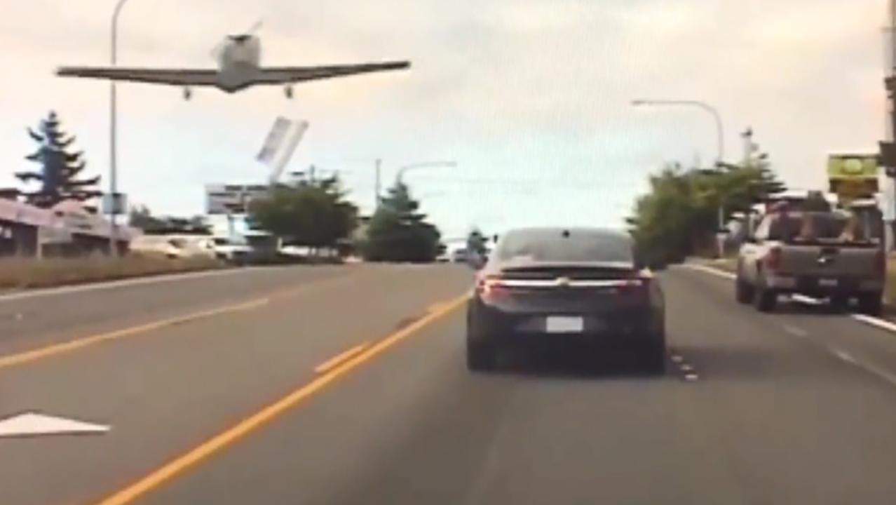Small plane forced to make emergency landing on busy road 