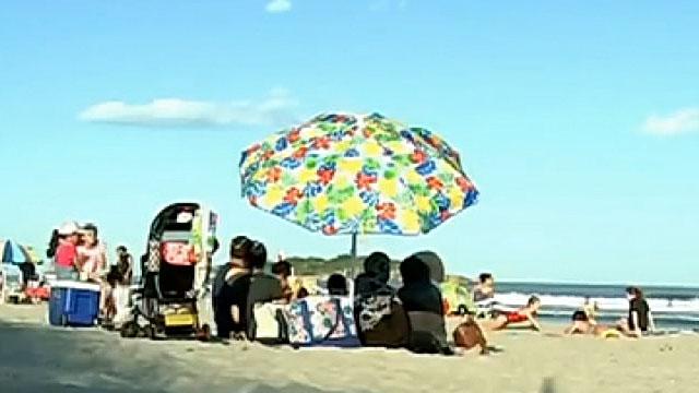 Teen hospitalized after being struck by beach umbrella 