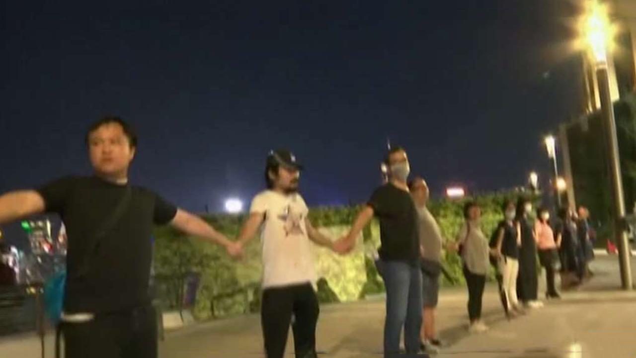 Hong Kong demonstrators form human chain in protest against government