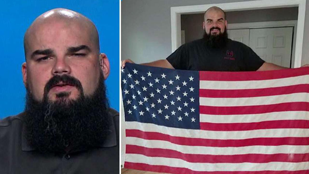 Man risks life recovering tattered American flag from busy highway