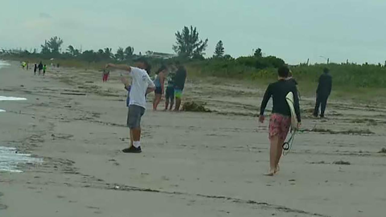 Hurricane Dorian Residents walk beach as conditions improve in