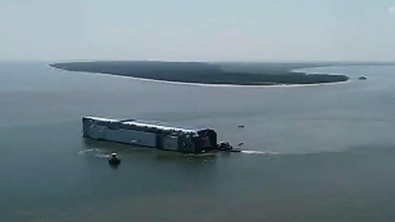 Cargo ship overturns near Georgia port, 4 missing crew members