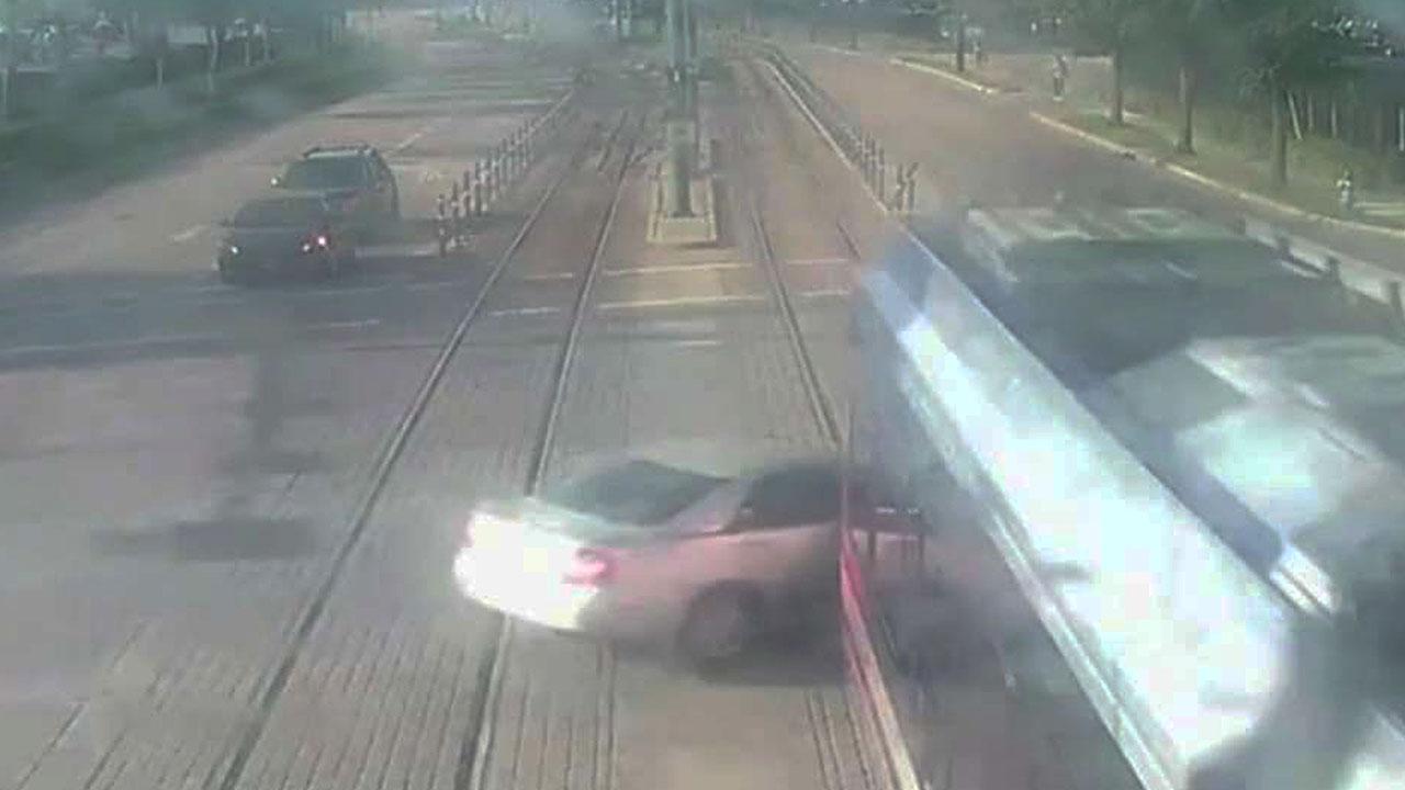 Surveillance cameras catch moment train smashes into car in Houston