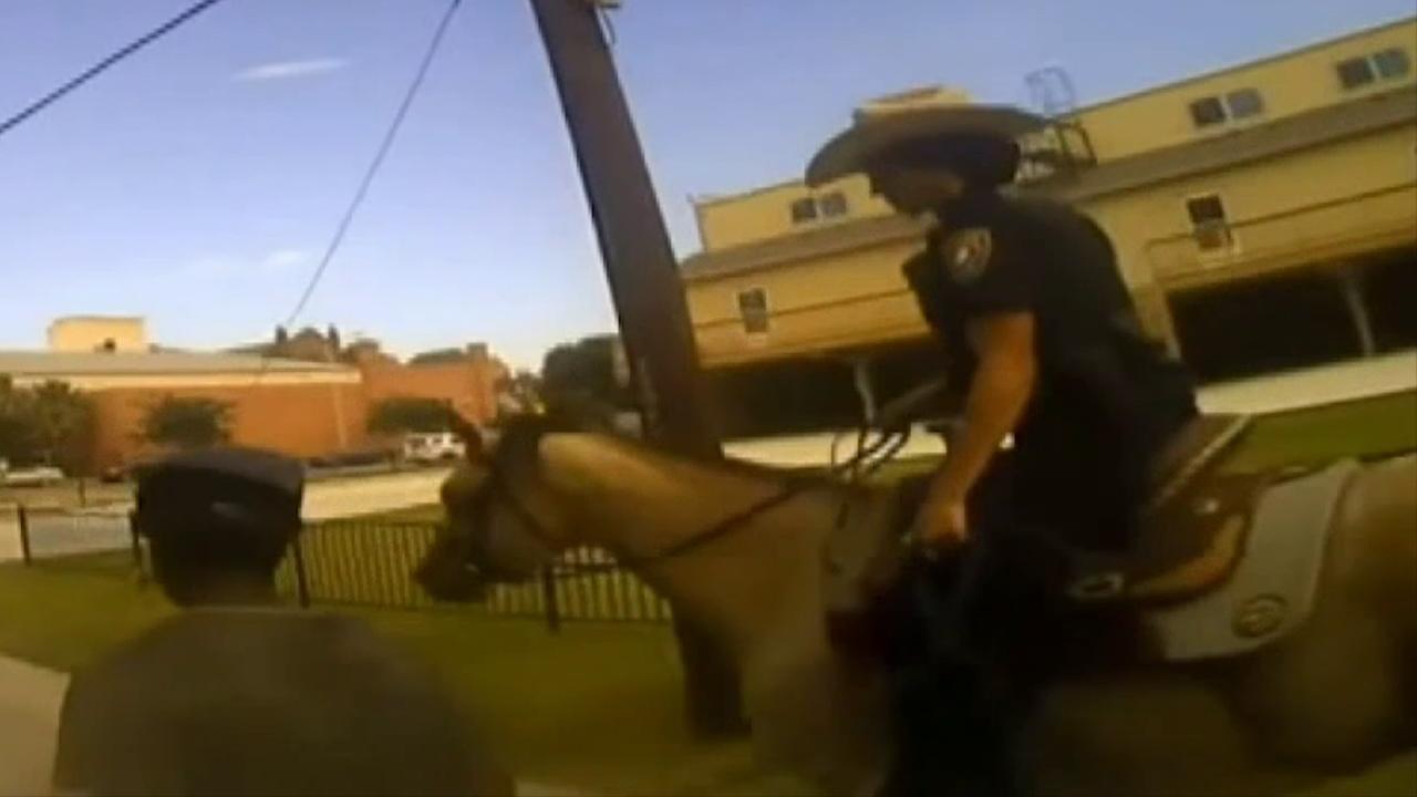 Police release bodycam video of mounted police officer tying suspect with rope, making him walking behind horse