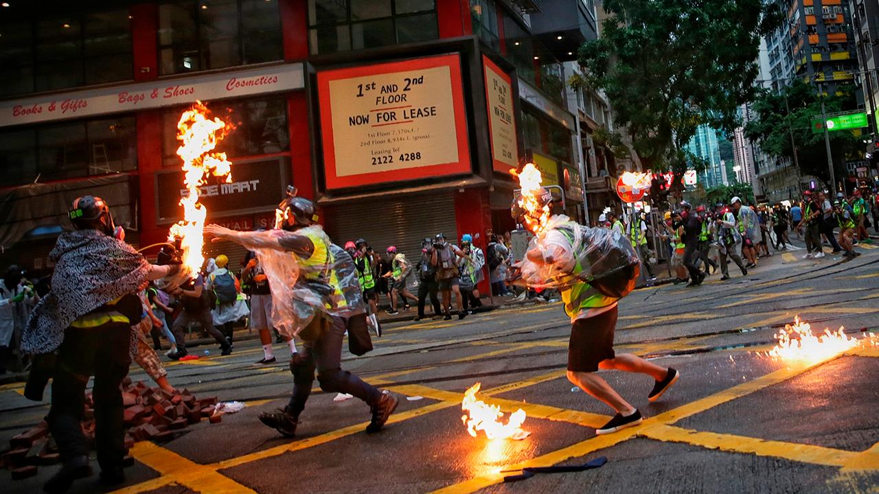 Hong Kong rallies turn violent as protesters defy face mask ban