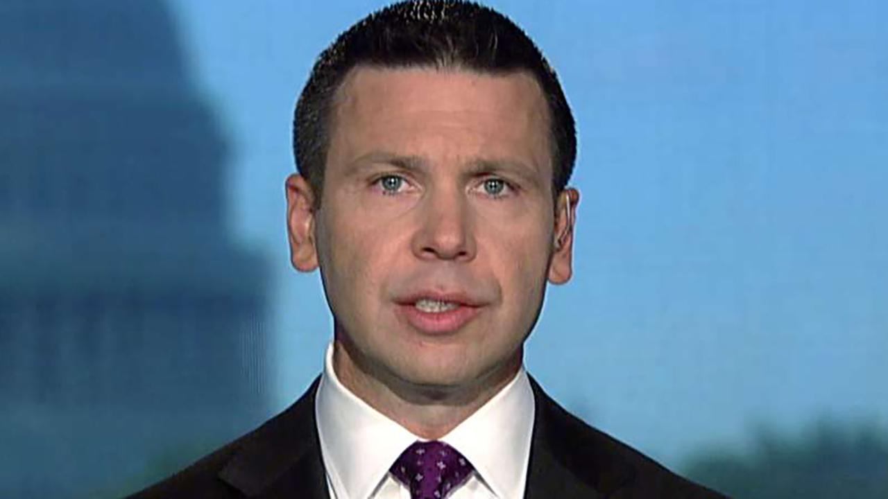 McAleenan reacts to being shouted off stage at Georgetown Law School