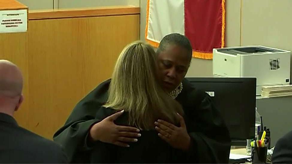 Judge defends hugging Amber Guyger after murder trial