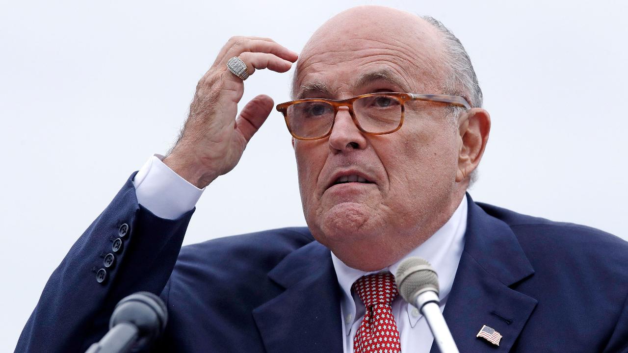 Rudy Giuliani finds timing of clients' arrest and indictment suspicious