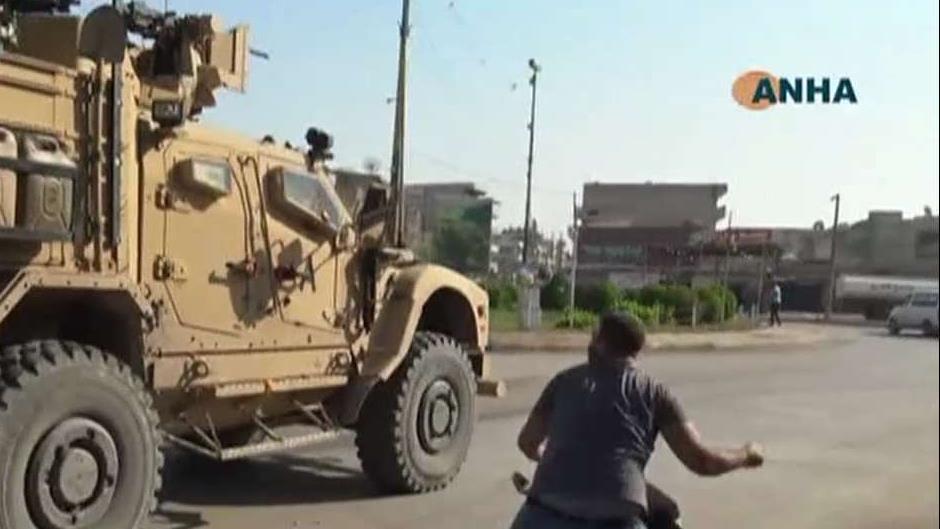 Kurdish protesters throw rocks, potatoes at departing US troops